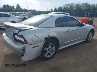 2004 Ford Mustang Standard with VIN 1FAFP40604F211340, listed as a IAAI auction lot 42071445 with Not provided miles and . Bid and sale history available at DreamBid. Image 4.