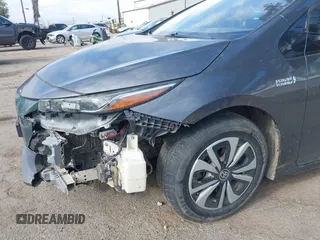 2018 Toyota Prius Plus with VIN JTDKARFPXJ3104302, listed as a IAAI auction lot 42127312 with 87,531 mi miles and . Bid and sale history available at DreamBid. Image 6.