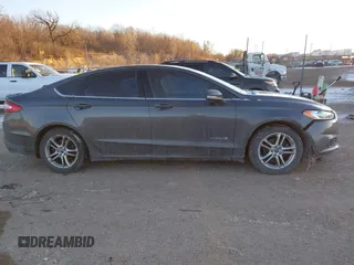 2015 Ford Fusion SE Hybrid with VIN 3FA6P0LU1FR219908, listed as a IAAI auction lot 41272688 with 310,452 mi miles. Bid and sale history available at carsss.com. Image 14.