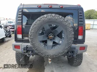 2006 Hummer H2 with VIN 5GRGN23U26H100264, listed as a Copart auction lot 58083494 with 169,104 mi miles and Salvage Title. Bid and sale history available at carsss.com. Image 6.
