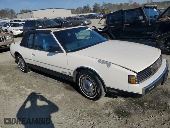 1987 Oldsmobile Toronado with VIN 1G3EZ1130HU307201, listed as a Copart auction lot 78028584 with 104,837 mi miles and Salvage Title. Bid and sale history available at DreamBid. Image 4.