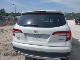 2022 Honda Pilot Touring 7-Passenger z VIN 5FNYF5H67NB027356, wystawiony jako IAAI lot #42080323 z przebiegiem 56 826 mil mil oraz . Historia ofert i sprzedaży dostępna na DreamBid. Obrazek 16.