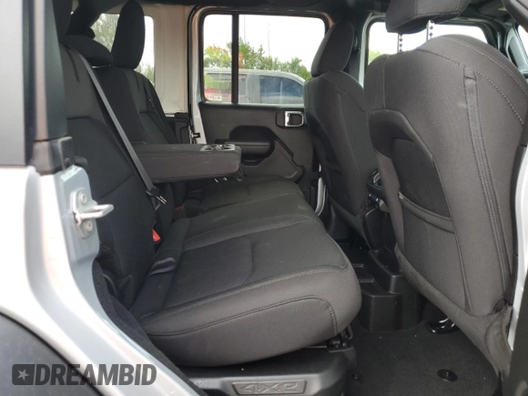2023 Jeep Wrangler z VIN 1C4JJXN64PW630179, wystawiony jako Copart lot #53879415 z przebiegiem 27 905 mil mil oraz Czysty tytuł • Clean title. Historia ofert i sprzedaży dostępna na DreamBid. Obrazek 10.