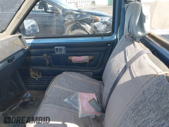 1989 Nissan Hardbody z VIN 1N6ND11S7KC338798, wystawiony jako IAAI lot #42328305 z przebiegiem 153 347 mil mil oraz . Historia ofert i sprzedaży dostępna na DreamBid. Obrazek 5.