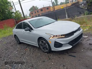 2024 Kia K5 GT-Line z VIN 5XXG64J29RG258548, wystawiony jako IAAI lot #39775391 z przebiegiem 22 745 mil mil oraz . Historia ofert i sprzedaży dostępna na DreamBid. Obrazek 1.
