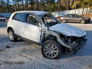 2014 Volkswagen Tiguan SE z VIN WVGAV3AX1EW523157, wystawiony jako Copart lot #82111894 z przebiegiem 103 172 mil mil oraz Szkoda całkowita • Salvage title. Historia ofert i sprzedaży dostępna na DreamBid. Obrazek 4.