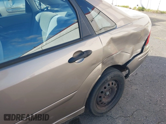 2004 Ford Focus SE with VIN 1FAFP34354W167961, listed as a IAAI auction lot 41545304 with 128,560 mi miles and . Bid and sale history available at DreamBid. Image 17.