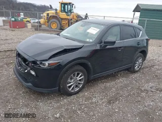 2023 Mazda CX-5 2.5 S Carbon Edition with VIN JM3KFBCM9P0130796, listed as a IAAI auction lot 41956104 with 21,796 mi miles. Bid and sale history available at carsss.com. Image 2.