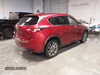 2020 Mazda CX-5 Grand Touring with VIN JM3KFBDM1L1809951, listed as a IAAI auction lot 41345854 with 117,376 mi miles. Bid and sale history available at carsss.com. Image 4.