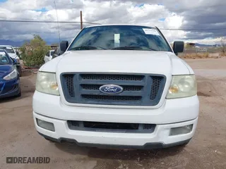 2005 Ford F-150 XL with VIN 1FTRF12W05NB36068, listed as a IAAI auction lot 41732744 with 203,261 mi miles. Bid and sale history available at carsss.com. Image 12.