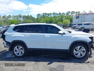2021 Volkswagen Atlas SE z VIN 1V2WR2CA2MC529355, wystawiony jako IAAI lot #41972048 z przebiegiem 63 970 mil mil oraz . Historia ofert i sprzedaży dostępna na DreamBid. Obrazek 13.