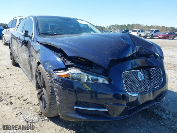 2014 Jaguar XJ with VIN SAJWA2GZ4E8V60251, listed as a IAAI auction lot 41778702 with NaN miles. Bid and sale history available at carsss.com. Image 6.