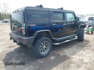 2007 Hummer H2 SUV z VIN 5GRGN23UX7H112972, wystawiony jako IAAI lot #41980625 z przebiegiem 214 857 mil mil oraz . Historia ofert i sprzedaży dostępna na DreamBid. Obrazek 4.