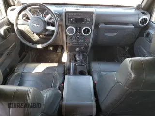 2008 Jeep Wrangler Unlimited Sahara with VIN 1J4GB59138L506461, listed as a Copart auction lot 75082664 with 178,944 mi miles and Salvage title. Bid and sale history available at DreamBid. Image 8.