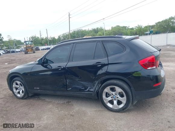 2014 BMW X1 sDrive28i with VIN WBAVM1C54EVW46561, listed as a IAAI auction lot 41880387 with 125,096 mi miles. Bid and sale history available at carsss.com. Image 14.