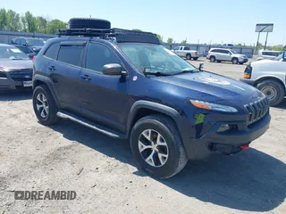 2015 Jeep Cherokee Trailhawk with VIN 1C4PJMBS0FW729736, listed as a IAAI auction lot 41994345 with 153,042 mi miles and . Bid and sale history available at DreamBid. Image 1.