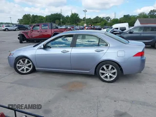 2004 Acura TSX w/Navigation with VIN JH4CL96944C045735, listed as a IAAI auction lot 42042197 with 197,900 mi miles. Bid and sale history available at carsss.com. Image 14.