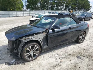 2016 BMW 2 Series 228i with VIN WBA1K9C5XGV710088, listed as a Copart auction lot 60126395 with 99,936 mi miles and Salvage title. Bid and sale history available at DreamBid. Image 1.