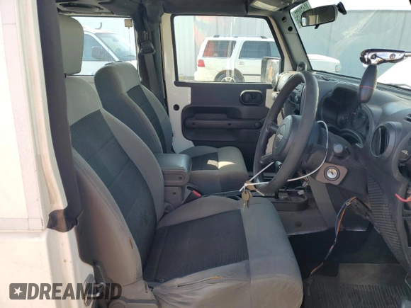 2008 Jeep Wrangler X with VIN 1J4FZ24128L612526, listed as a Copart auction lot 49152275 with 128,584 mi miles and Clean title. Bid and sale history available at DreamBid. Image 7.