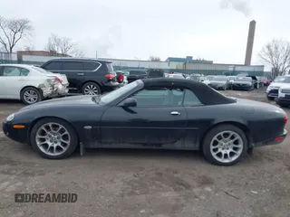 1997 Jaguar XK with VIN SAJGX274XVC017622, listed as a IAAI auction lot 41614339 with 94,298 mi miles and . Bid and sale history available at DreamBid. Image 13.