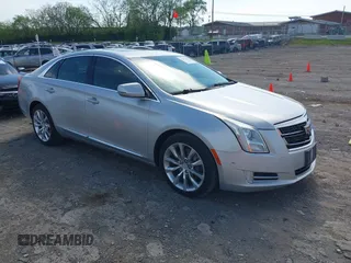 2016 Cadillac XTS Luxury Collection z VIN 2G61M5S33G9107107, wystawiony jako IAAI lot #42072608 z przebiegiem 130 542 mil mil oraz . Historia ofert i sprzedaży dostępna na DreamBid. Obrazek 1.