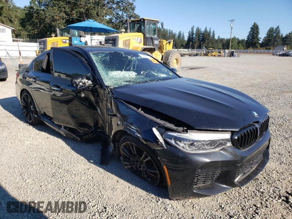 2018 BMW M5 z VIN WBSJF0C57JB283361, wystawiony jako Copart lot #65352164 z przebiegiem Nie podano mil oraz Szkoda całkowita • Salvage title. Historia ofert i sprzedaży dostępna na DreamBid. Obrazek 4.