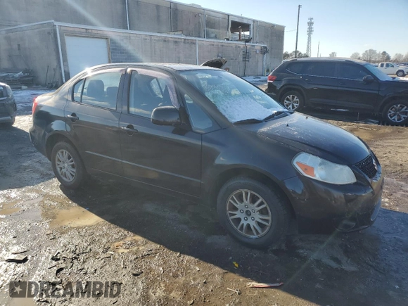 2012 Suzuki SX4 LE with VIN JS2YC5A3XC6303083, listed as a Copart auction lot 89265635 with 155,316 mi miles and Salvage Title. Bid and sale history available at carsss.com. Image 4.