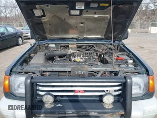 1995 Mitsubishi Montero z VIN JA4MR41H7SJ010597, wystawiony jako IAAI lot #41610885 z przebiegiem 162 406 mil mil oraz . Historia ofert i sprzedaży dostępna na DreamBid. Obrazek 10.