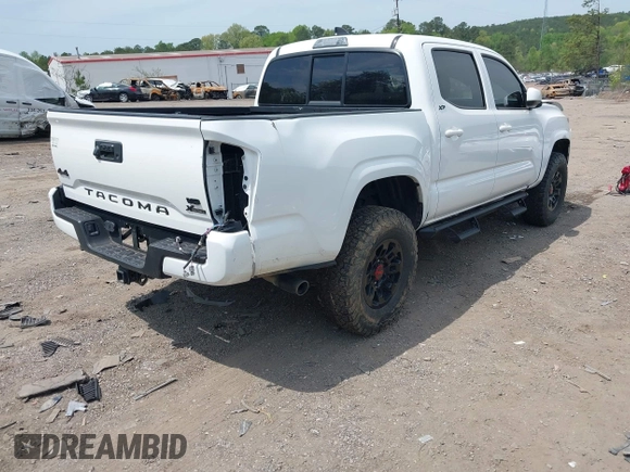 2021 Toyota Tacoma 4WD SR with VIN 3TMCZ5AN2MM414975, listed as a IAAI auction lot 41997227 with 57,729 mi miles. Bid and sale history available at carsss.com. Image 4.