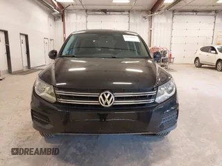 2014 Volkswagen Tiguan SE z VIN WVGAV3AX9EW614094, wystawiony jako IAAI lot #42350601 z przebiegiem 128 996 mil mil oraz . Historia ofert i sprzedaży dostępna na DreamBid. Obrazek 13.