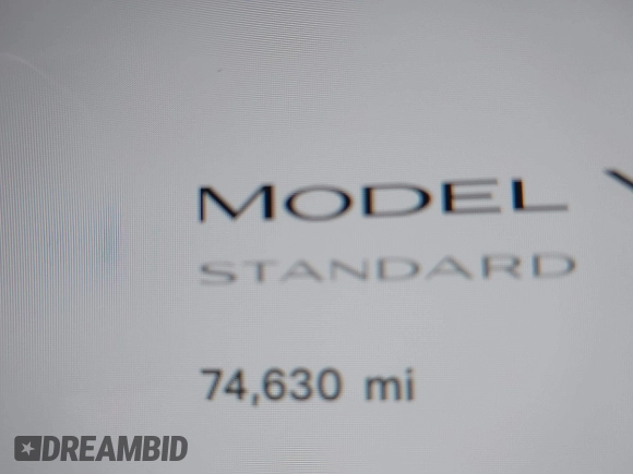 2021 Tesla Model Y Standard Range with VIN 5YJYGDED8MF123246, listed as a IAAI auction lot 41291676 with 74,630 mi miles and . Bid and sale history available at DreamBid. Image 7.