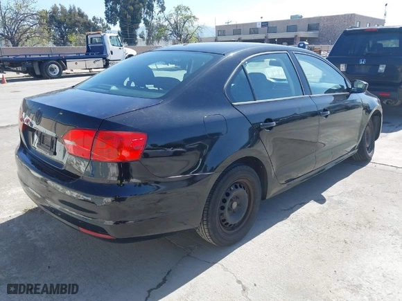 2014 Volkswagen Jetta Sedan S with VIN 3VW2K7AJ6EM439921, listed as a IAAI auction lot 41950102 with 140,023 mi miles. Bid and sale history available at carsss.com. Image 4.