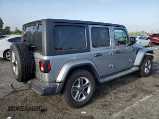 2019 Jeep Wrangler Unlimited Sahara with VIN 1C4HJXEN0KW616942, listed as a Copart auction lot 63501755 with 57,095 mi miles and Salvage title. Bid and sale history available at DreamBid. Image 3.