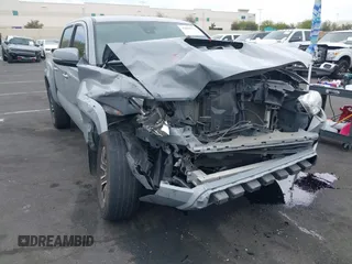 2021 Toyota Tacoma SR z VIN 3TMCZ5AN2MM405869, wystawiony jako IAAI lot #42094533 z przebiegiem 78 449 mil mil oraz . Historia ofert i sprzedaży dostępna na DreamBid. Obrazek 1.