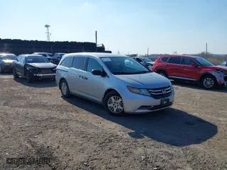 2015 Honda Odyssey LX with VIN 5FNRL5H22FB061572, listed as a IAAI auction lot 41773878 with 178,154 mi miles. Bid and sale history available at carsss.com. Image 1.