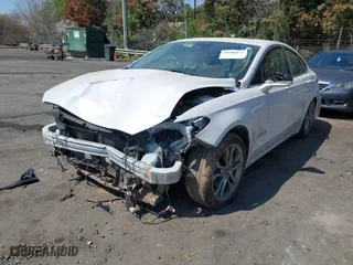 2019 Ford Fusion Hybrid Titanium with VIN 3FA6P0RU9KR126815, listed as a IAAI auction lot 41908472 with 146,059 mi miles. Bid and sale history available at carsss.com. Image 2.