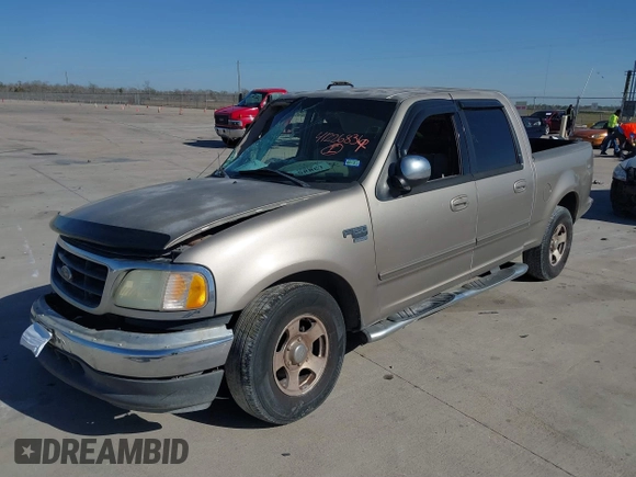 2002 Ford F-150 XLT with VIN 1FTRW07672KB31448, listed as a IAAI auction lot 41226836 with 265,234 mi miles. Bid and sale history available at carsss.com. Image 2.