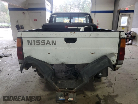 1988 Nissan Hardbody E z VIN 1N6ND16Y3JC351348, wystawiony jako Copart lot #80864914 z przebiegiem 184 397 mil mil oraz Szkody całkowita. Historia ofert i sprzedaży dostępna na DreamBid. Obrazek 6.