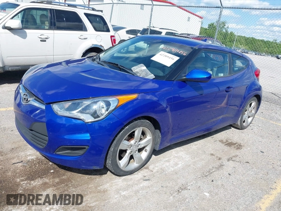 2012 Hyundai Veloster w/Gray Int z VIN KMHTC6AD3CU074501, wystawiony jako IAAI lot #42289456 z przebiegiem 94 303 mil mil oraz . Historia ofert i sprzedaży dostępna na DreamBid. Obrazek 2.