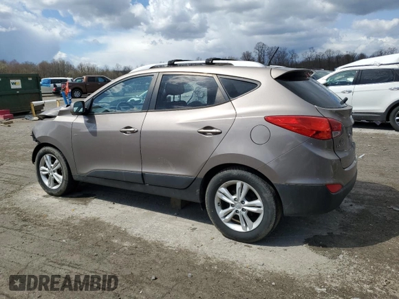 2011 Hyundai Tucson Limited with VIN KM8JUCAC2BU200517, listed as a Copart auction lot 53252005 with 158,502 mi miles and Salvage Title. Bid and sale history available at DreamBid. Image 2.