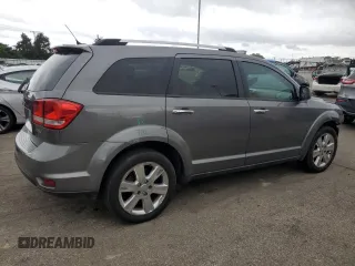 2012 Dodge Journey Crew with VIN 3C4PDDDG6CT275610, listed as a Copart auction lot 57063865 with 126,319 mi miles and Salvage title. Bid and sale history available at DreamBid. Image 3.