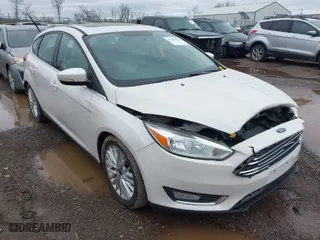 2015 Ford Focus Titanium with VIN 1FADP3N23FL293432, listed as a IAAI auction lot 41929774 with 100,865 mi miles. Bid and sale history available at carsss.com. Image 1.