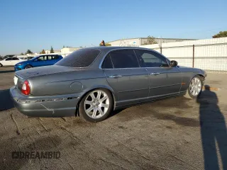 2004 Jaguar XJ with VIN SAJWA71C74SG20299, listed as a Copart auction lot 79469504 with 78,134 mi miles and Salvage Title. Bid and sale history available at carsss.com. Image 3.
