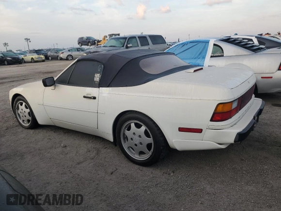 1990 Porsche 944 with VIN WP0CB2949LN481351, listed as a Copart auction lot 75335194 with 70,964 mi miles and Salvage title. Bid and sale history available at DreamBid. Image 2.
