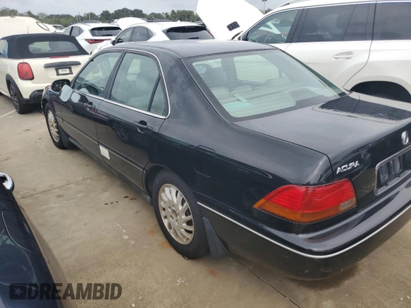 1998 Acura RL Premium with VIN JH4KA9656WC001298, listed as a Copart auction lot 73740154 with 108,066 mi miles and Salvage Title. Bid and sale history available at carsss.com. Image 2.