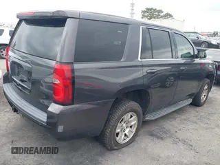 2017 Chevrolet Tahoe Commercial with VIN 1GNLCDEC0HR303602, listed as a IAAI auction lot 41718630 with 196,484 mi miles and . Bid and sale history available at DreamBid. Image 4.