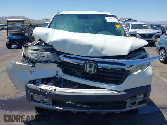 2019 Honda Ridgeline RTL-E with VIN 5FPYK3F74KB009279, listed as a IAAI auction lot 42348773 with 98,141 mi miles and . Bid and sale history available at DreamBid. Image 12.