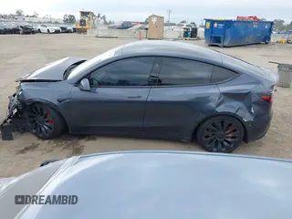 2023 Tesla Model Y Performance z VIN 7SAYGDEF1PF925274, wystawiony jako IAAI lot #42078813 z przebiegiem 20 422 mil mil oraz . Historia ofert i sprzedaży dostępna na DreamBid. Obrazek 13.