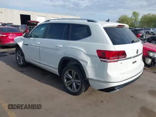 2018 Volkswagen Atlas SE z VIN 1V2FR2CA2JC540657, wystawiony jako IAAI lot #42115554 z przebiegiem 107 309 mil mil oraz . Historia ofert i sprzedaży dostępna na DreamBid. Obrazek 3.