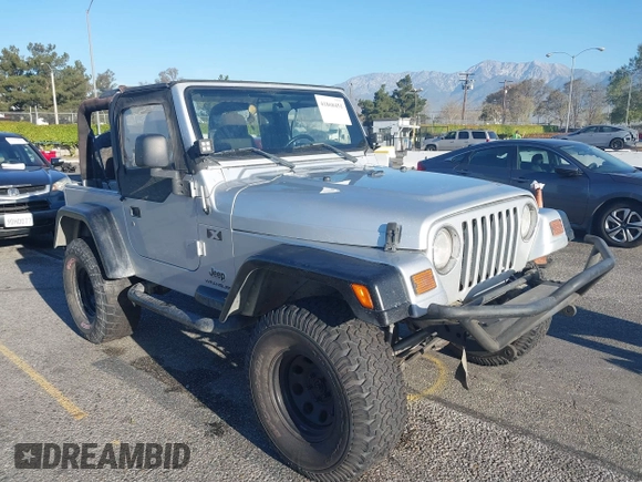 2005 Jeep Wrangler X with VIN 1J4FA39S55P348432, listed as a IAAI auction lot 41868451 with 166,876 mi miles. Bid and sale history available at carsss.com. Image 1.